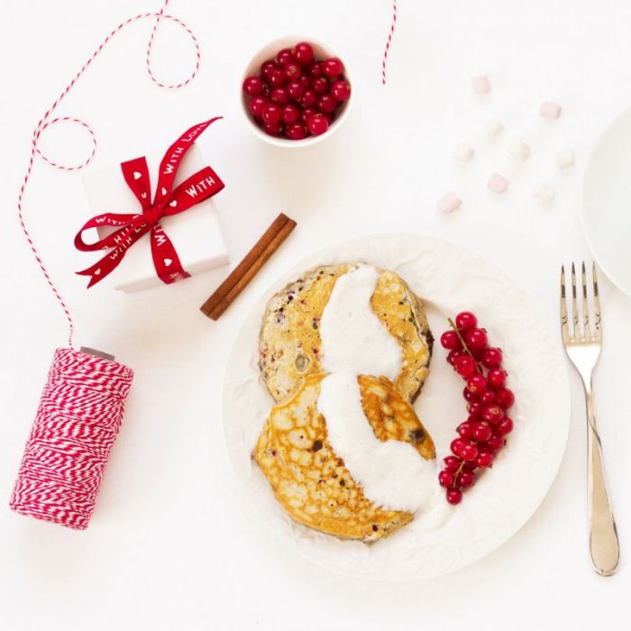 Christmas pancakes with berries, twine and present