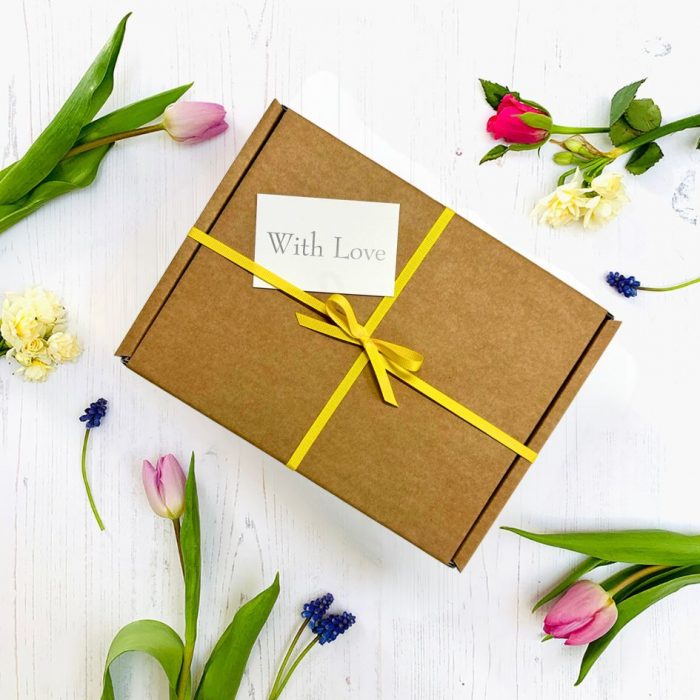 Easter gift box with yellow ribbon and gift tag